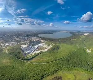 Ural Prints: Stone quarry in the forest. Flying over the summer mixed forest during sunset