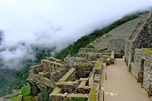 Inca Prints: Stone ruins and agricultural terraces of Machu Picchu rising above the cloud forest in the Peruvian Andes