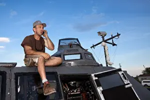 Armored Prints: Storm Chaser and IMAX videographer Sean Casey sits on TIV during Project Vortex 2