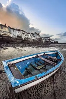 Rowing Boat Prints: Storm clouds gather over the boats moored on the River Torridge estuary at Appledore in North Devon