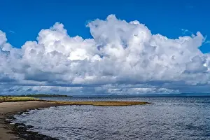 Storm Clouds Prints: Storm clouds rising above the sandy beach of Willapa Bay at Leadbetter Point State Park in Washington