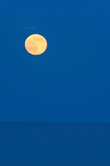 Salt Water Prints: Full strawberry moon rises over the Atlantic Ocean