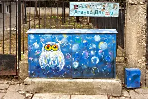 Sofia Prints: Street art painting of an owl in blue on street cabinet in Sofia, Bulgaria