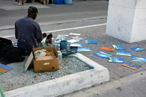 Bahamas Prints: Street artist selling his paintings on the street near Straw market in Nassau