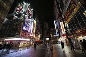 Honshu Prints: Street with illuminated shops and neon signs at night in Akihabara