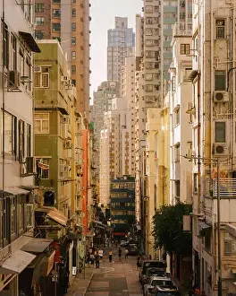 Urban Growth Prints: Street view of Central district Hong Kong with dense towers streetscape looking towards Sheung Wan