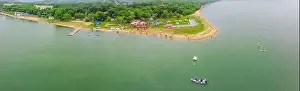 Corinth Prints: Strong men floating on a SUP boards in a beautiful bay on a sunny day