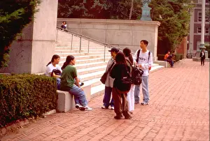 Communicating Prints: Students age 20 hanging out on the mall at Columbia University. New York New York USA