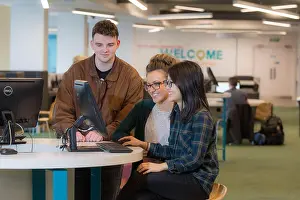 Searching Prints: students studying together with computer