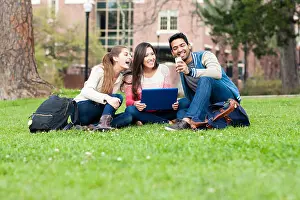 Multicultural Prints: Students taking cell phone photograph on campus