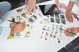 Part Of Prints: Students working with tablet pc and photos