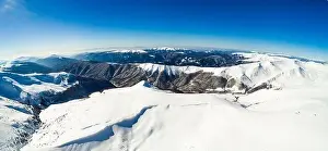 Mountain White Prints: Stunning aerial view of the mountain ranges on a winter sunny frosty day