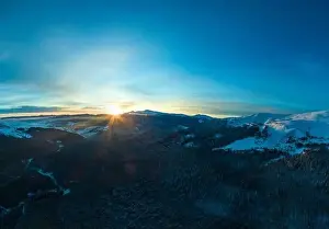 Hill Glacier Prints: Stunning winter panorama with trees and hills covered with snow on a sunny frosty day