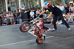 Motorcycles Prints: Stunt man riding motorbike at the annual Bangkok motorcycle show. Thailand S. E. Asia