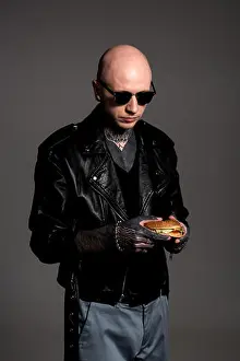 Bald Prints: stylish bald tattooed man in leather jacket and sunglasses looking at delicious burger in hands isolated on grey