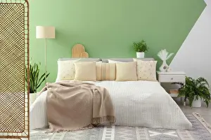 Bedding Prints: Stylish bedroom interior with large bed, houseplants and decorative elements