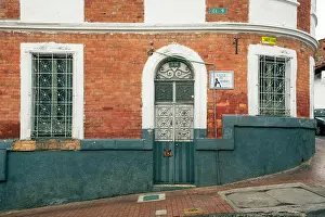 Brick Wall Prints: Stylish colonial exterior with decorated door and windows in La Candelaria