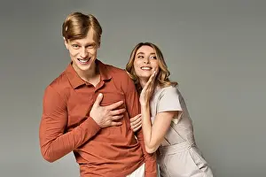 Poses Prints: A stylish couple playfully interacts in spring clothing