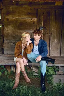 Intimacy Prints: Stylish couple relaxes outdoors together in summer attire, embracing their love