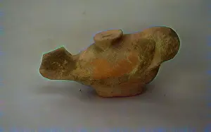 In Game Menus Prints: A stylized ceramic figure resembling a fish