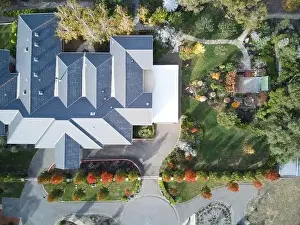 Urban Growth Prints: Suburban house Australia aerial view showing trees
