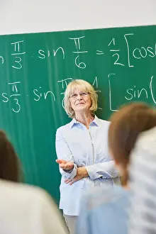 Senior Citizen Prints: Successful universitiy math teacher teaching students with competence