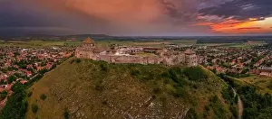 Veszprem Prints: Sumeg, Hungary - Aerial panoramic view of the famous High Castle of Sumeg in Veszprem county at sunset with storm