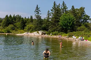 Bathing Suit Prints: A summer day brings people to Sand Beach, Deer Isle, Maine, USA