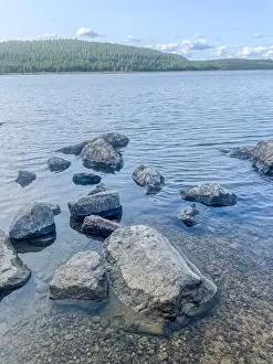 Water Reflections Prints: Summer serenity at Lake Inari – where endless daylight meets pristine Nordic beauty