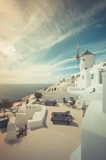Summer travel destinations. Picturesque cityscape of Oia village in Santorini island located volcanic caldera. Traditional windmills, luxury vacation