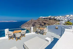 Summer vacation urban scenic of luxury famous destination. White architecture in Santorini, Greece. Perfect travel scenery with terrace sunny blue sky