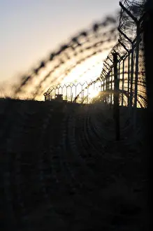 Hawk Prints: The sun rises along the outer boundary of Forward Operating Base Sharana, Afghanistan