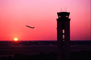 Screens Prints: Sun sets behind airport control tower, Orlando International Airport