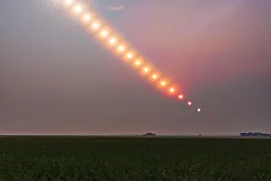 Non Urban Scene Prints: The Sun setting into a pall of forest fire smoke over Alberta, Canada