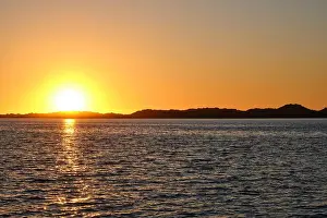 Western Australia Prints: The sun setting over sand dunes at Leschenault Estuary in Australind