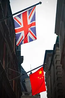 Decker Prints: Sun shines through the flags of Great Britain and China in the City of London