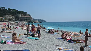 Cote Dazur Prints: Sunbathers populate the shoreline of the French Riviera