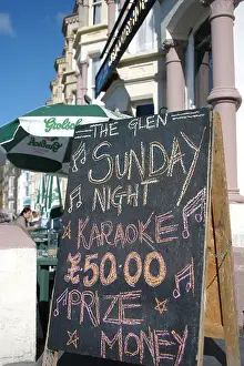 Aberystwyth Prints: Sunday night Karaoke advert on blackboard sign outside seafront bar pub Aberystwyth wales