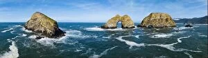 Images Dated 1st March 2023: Sunlight shines on rugged sea stacks off the northern coast of Oregon, not far from Tillamook
