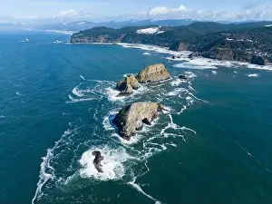 Sunlight shines on rugged sea stacks off the northern coast of Oregon, not far from Tillamook. This coastline has many outstanding viewpoints