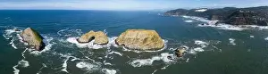 Sunlight shines on rugged sea stacks off the northern coast of Oregon, not far from Tillamook. This coastline has many outstanding viewpoints