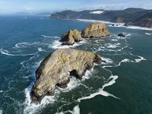 Sunlight shines on rugged sea stacks off the northern coast of Oregon, not far from Tillamook. This coastline has many outstanding viewpoints