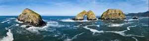 Sunlight shines on rugged sea stacks off the northern coast of Oregon, not far from Tillamook. This coastline has many outstanding viewpoints