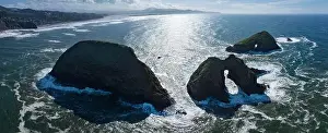Sea Stacks Prints: The sunlit Pacific Ocean washes onto rugged and scenic sea stacks off the northern coast of Oregon