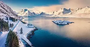 Sunny morning view from flying drone of Andopen fjord with Kakernbrua bridge on background