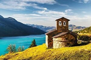 Images Dated 15th October 2018: Sunny picturesque view of stone chapel on Roselend lake (Lac de Roselend)