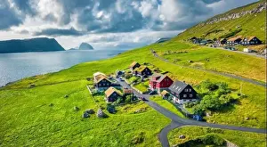 Faroe Island Prints: Sunny summer view from flying droneof Kirkjubour village with Hestur Island on background
