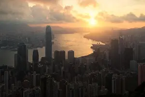 Sunrise over Hong Kong Victoria Harbor from Victoria Peak with Hong Kong and Kowloon below