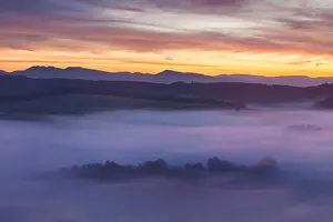 Sunrise Over Misty Landscape. Scenic View Of Foggy Morning Sky With Rising Sun Above Misty Forest