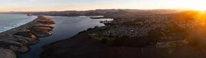 Aerial Landscape Collection: At sunrise the Pacific Ocean meets the beautiful shoreline of Central California in Morro Bay